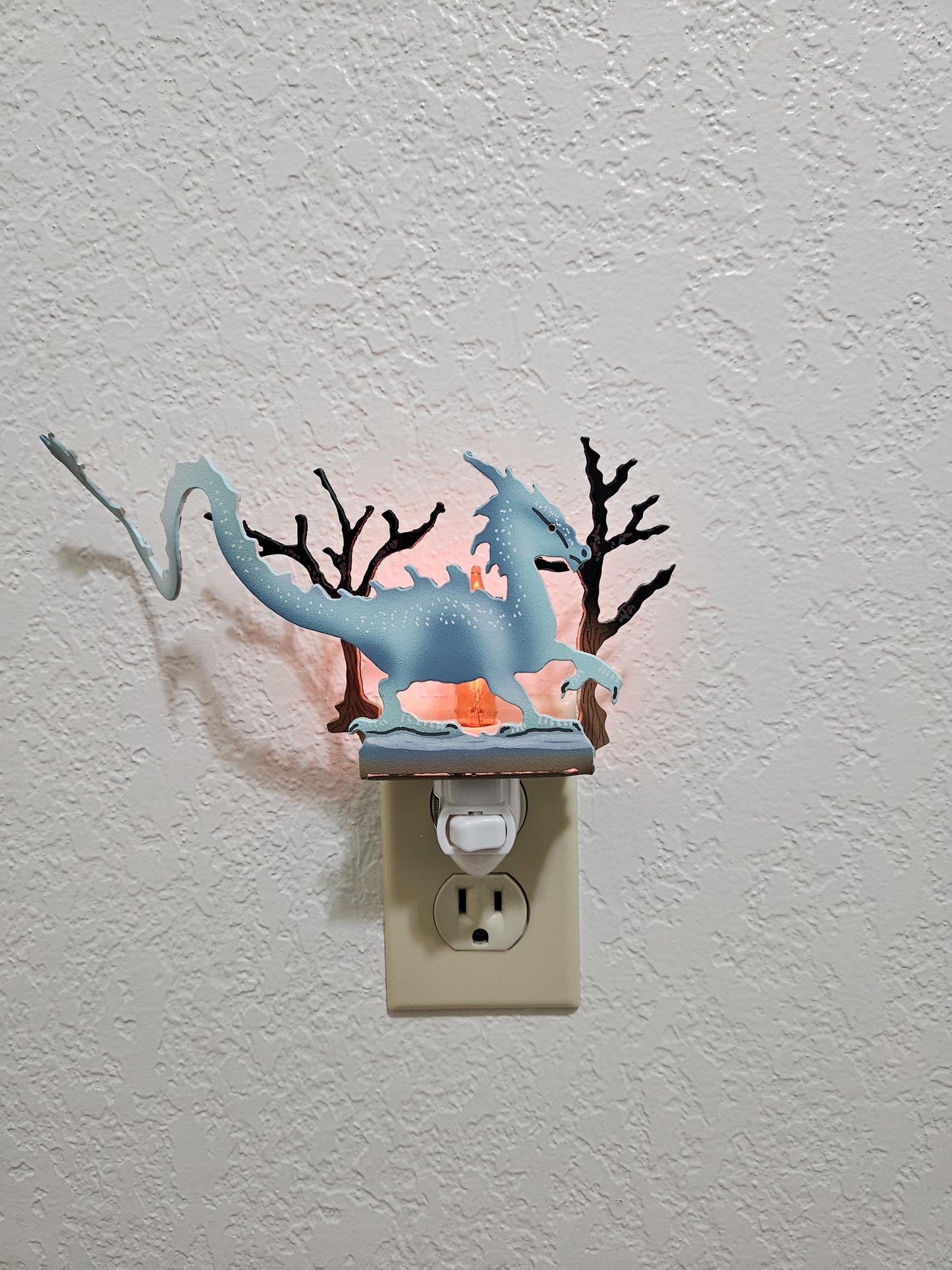 Ice Dragon Art as a Night Light with a flickering flame bulb- made from durable, hand-painted steel